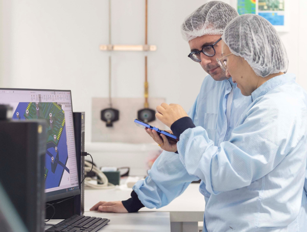 Photo of researchers working within in Advanced Packaging lab within the Rinn Semiconductors research centre